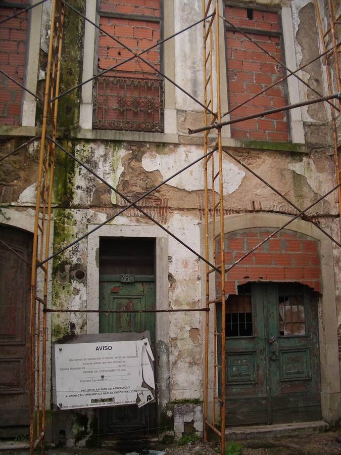 A building showing visible disrepair, the kind of condition issue buyers must spot before making an offer