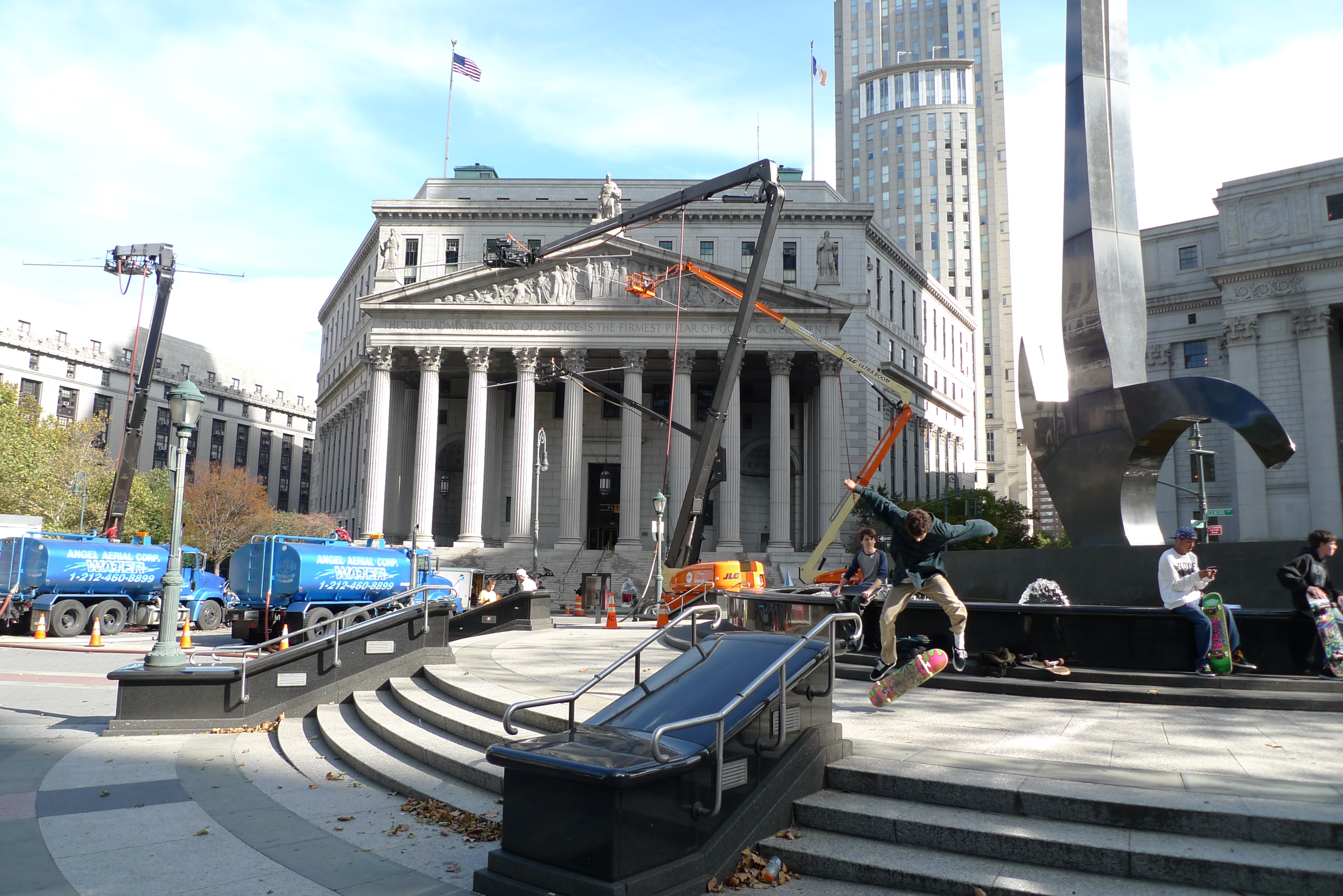 Foley Square in Manhattan's Civic Center, with the New York County Courthouse in the foreground and the federal courthouse tower behind it