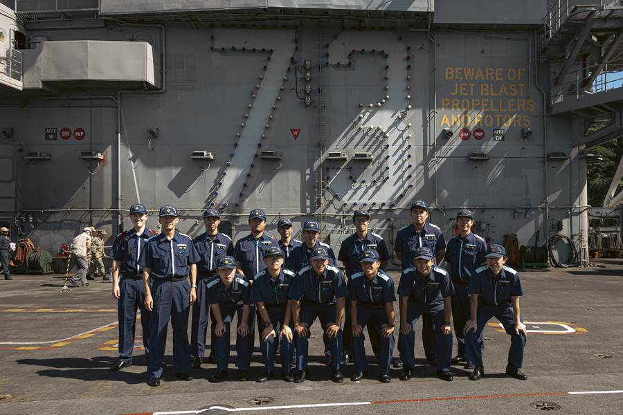 Japan Coast Guard sailors tour the flight deck of USS George Washington in Yokosuka