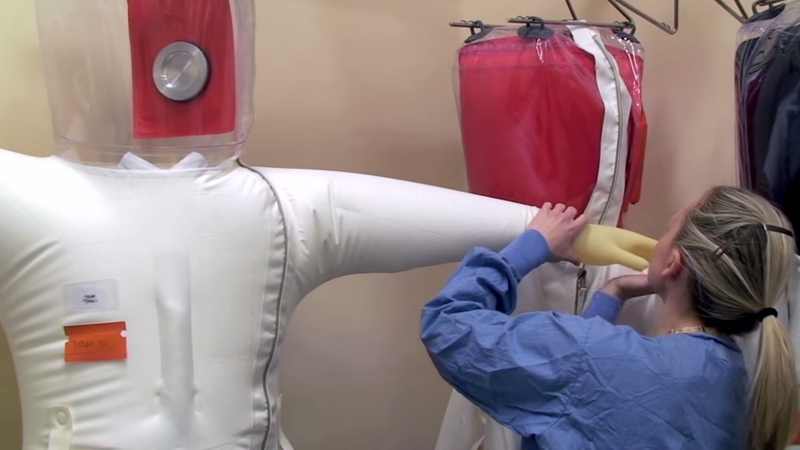 Positive-pressure personnel suit inspection at a BSL-4 laboratory like those used for plague research