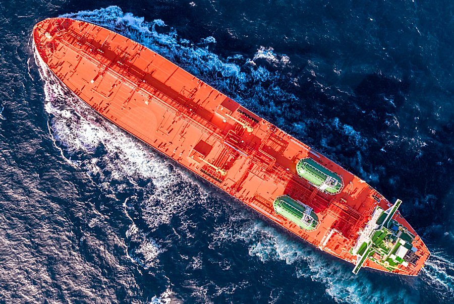 Aerial view of a red supertanker under way at sea — Strait of Hormuz tanker attack claim coverage