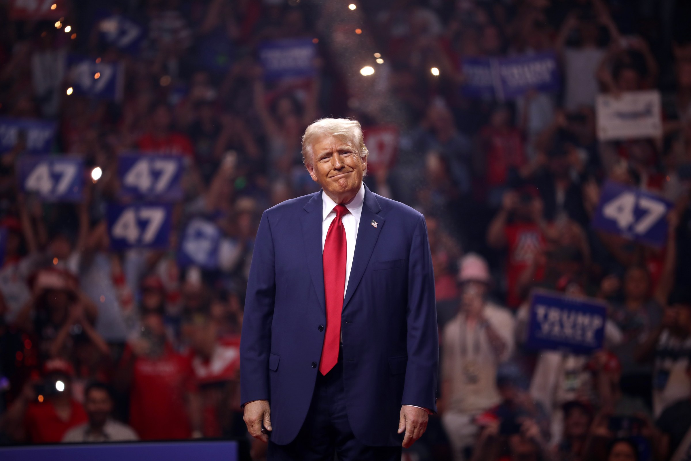 President Donald Trump standing before supporters at a campaign rally, in a file photograph illustrating the Trump Iran fake Hormuz attacks claim — on Thursday the president accused Iran of inventing ship attacks to drive up oil prices before the November 3 midterm elections