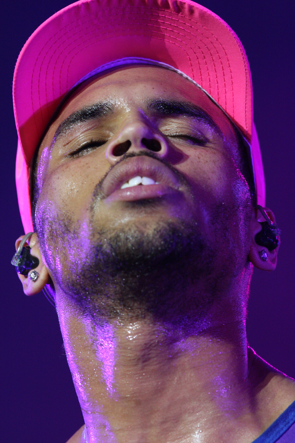A close-up file photo of Chris Brown performing, whose London sentencing for affray ended with an eight-month suspended term