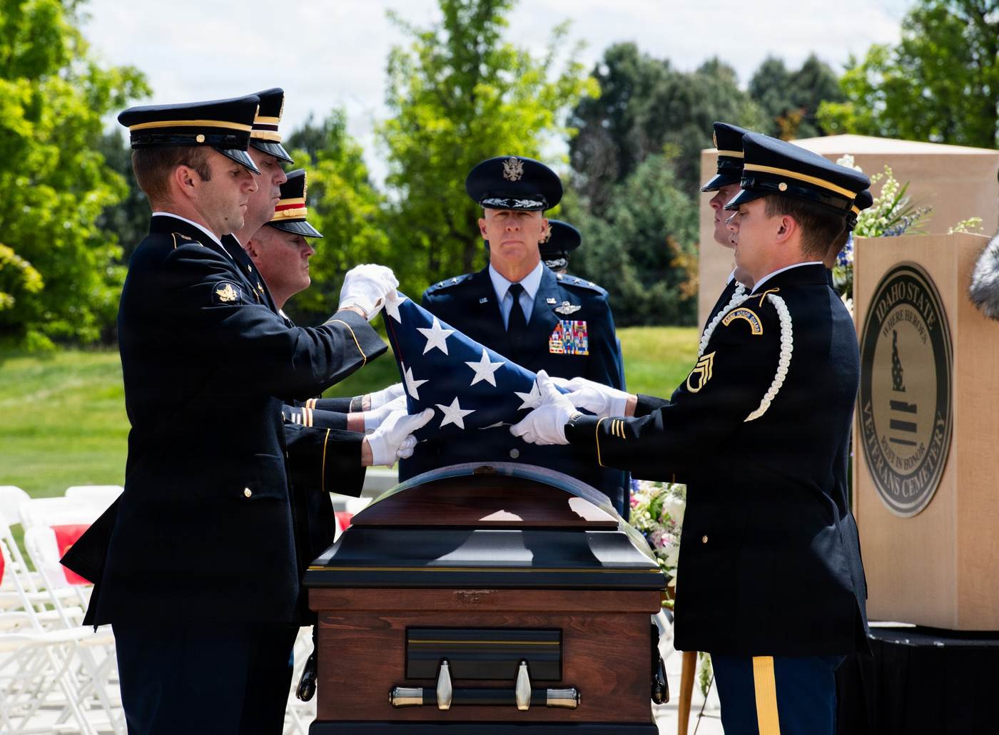 U.S. Army National Guard honor guard presents the American flag during a ceremony