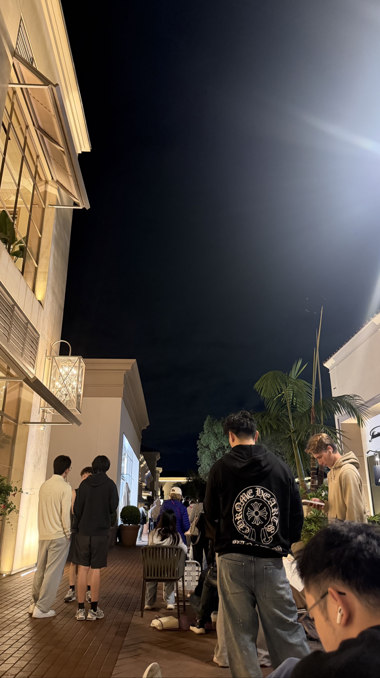 iPhone Duo launch day line before sunrise outside an Apple Store in Orange County, California