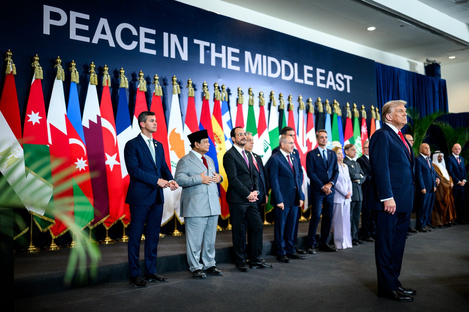 World leaders lined up before national flags under a Peace in the Middle East banner at Sharm El-Sheikh in 2025, an archive photo as regional defence pledges to Saudi Arabia multiply