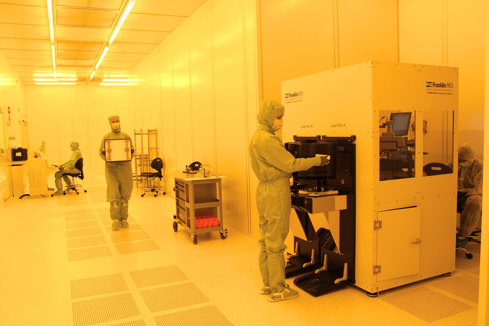 Workers in a semiconductor wafer fabrication cleanroom — file photo for the chip stock rebound