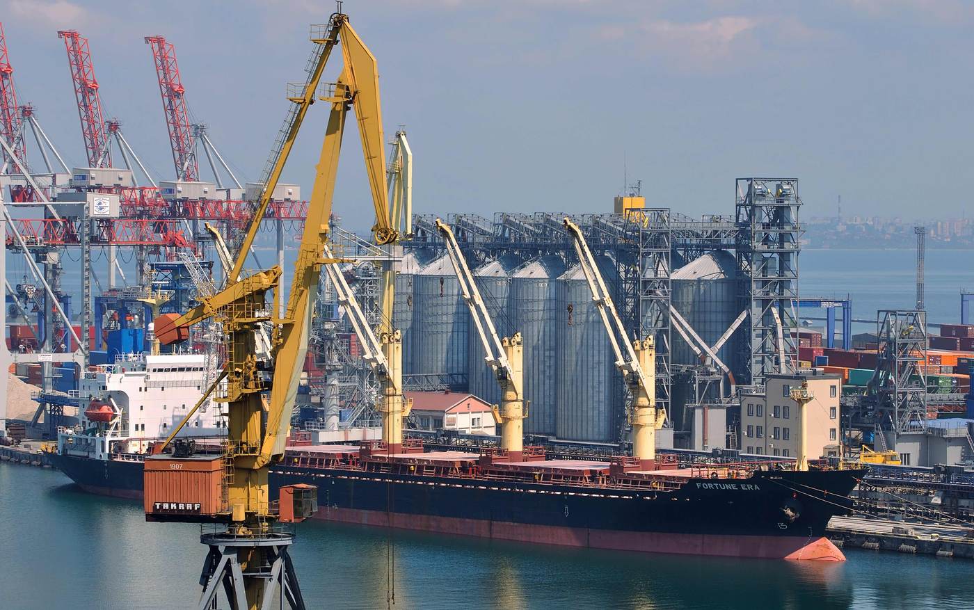 Cargo vessel, cranes and grain silos at a Ukrainian Black Sea port