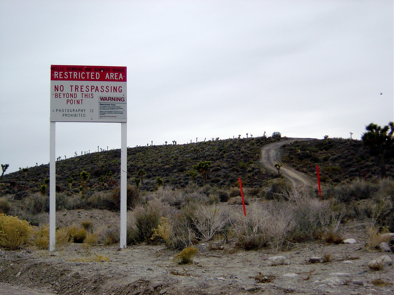 Warning sign reading Restricted Area, No Trespassing Beyond This Point at the boundary of Area 51 in Nevada