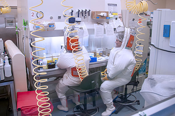 High-containment laboratory workers in positive-pressure suits at a NIAID BSL-4 facility