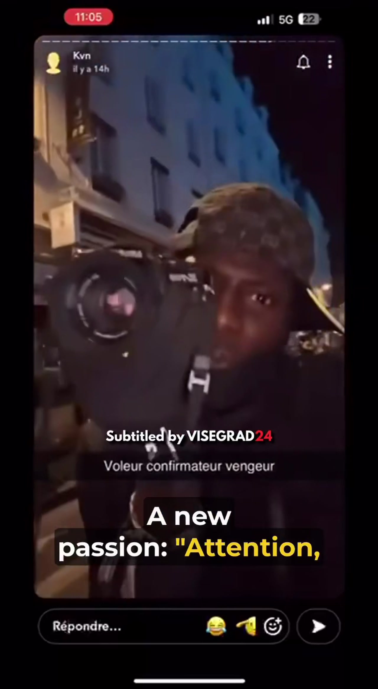 A masked man holds a camera up to the lens in the viral France looter video filmed during the October 17 unrest