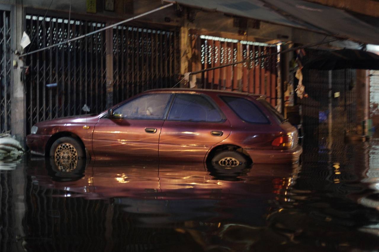 Car submerged in floodwater on a Bangkok street during the 2011 Thailand floods, file photo
