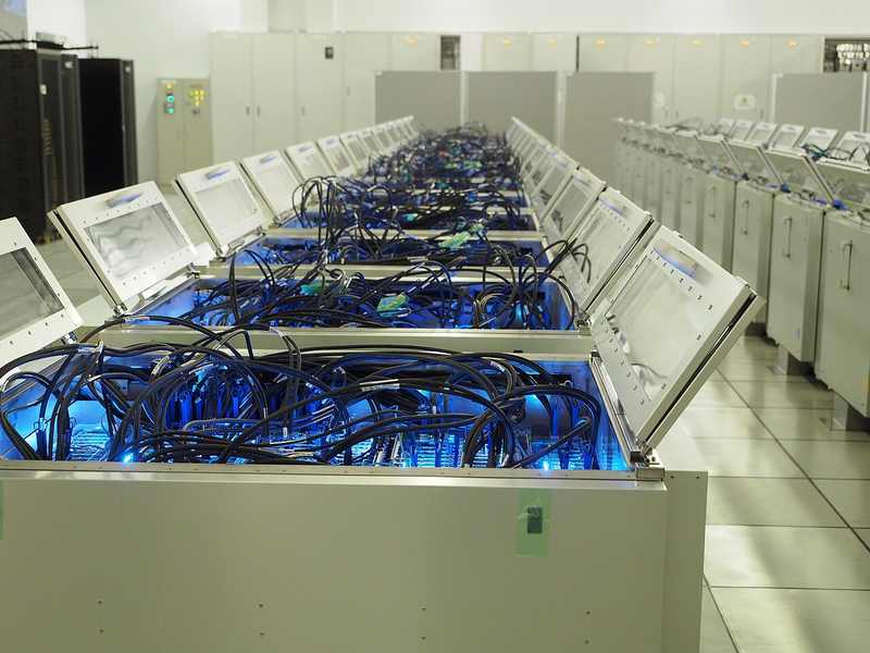 Rows of computing hardware inside the Gyoukou supercomputer facility in Japan