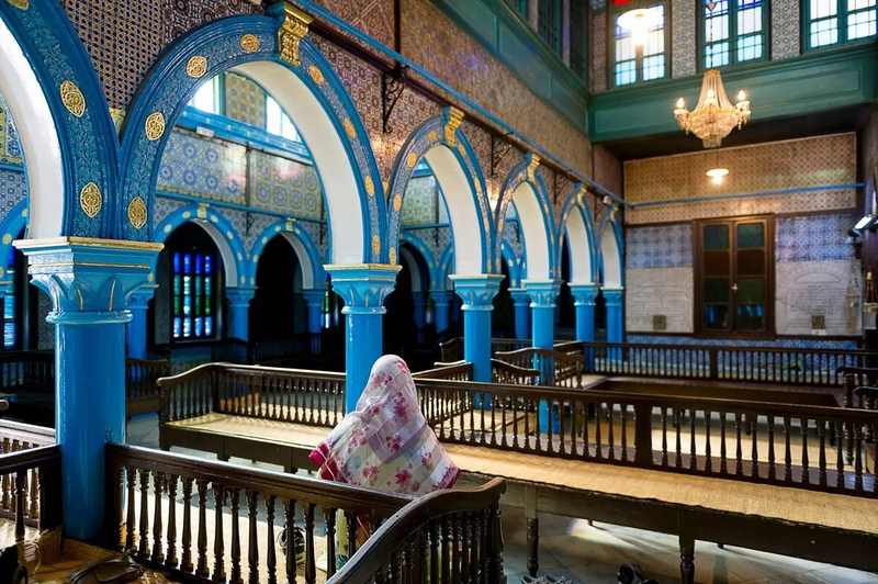Blue-arched interior of the Ghriba synagogue in Djerba, Tunisia