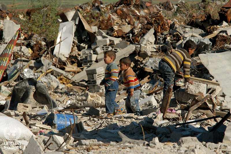 Boys salvaging a destroyed building in the Gaza Strip
