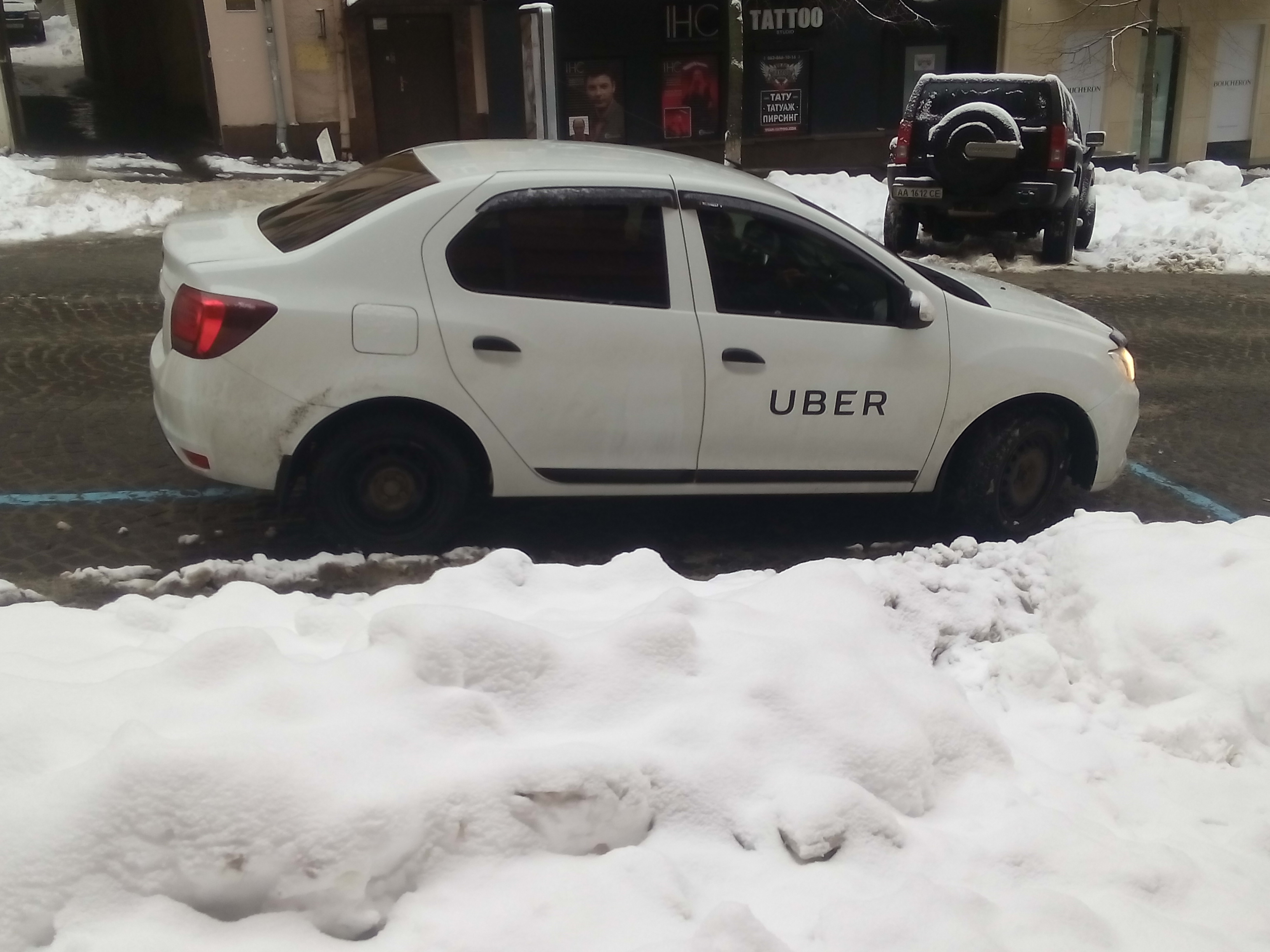 Instacart sale talks — an Uber-branded car, one of the two reported potential buyers, in a file photo