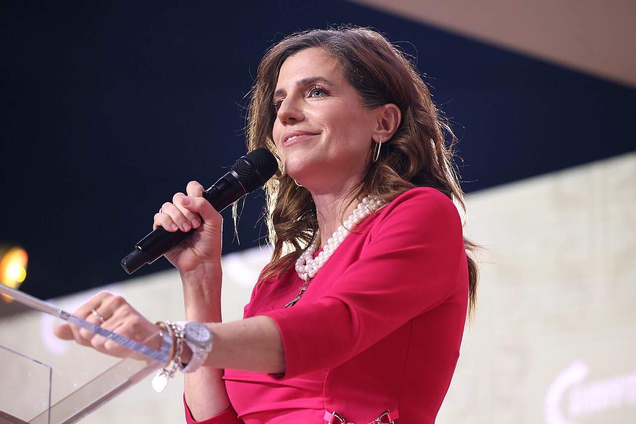 Rep. Nancy Mace speaking at a podium in 2025, as her ex-fiance Patrick Bryant is charged with sex crimes in South Carolina