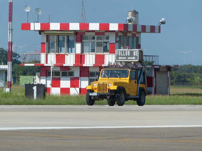 Follow-me vehicle and airfield operations building at Chihhang Air Base in Taitung