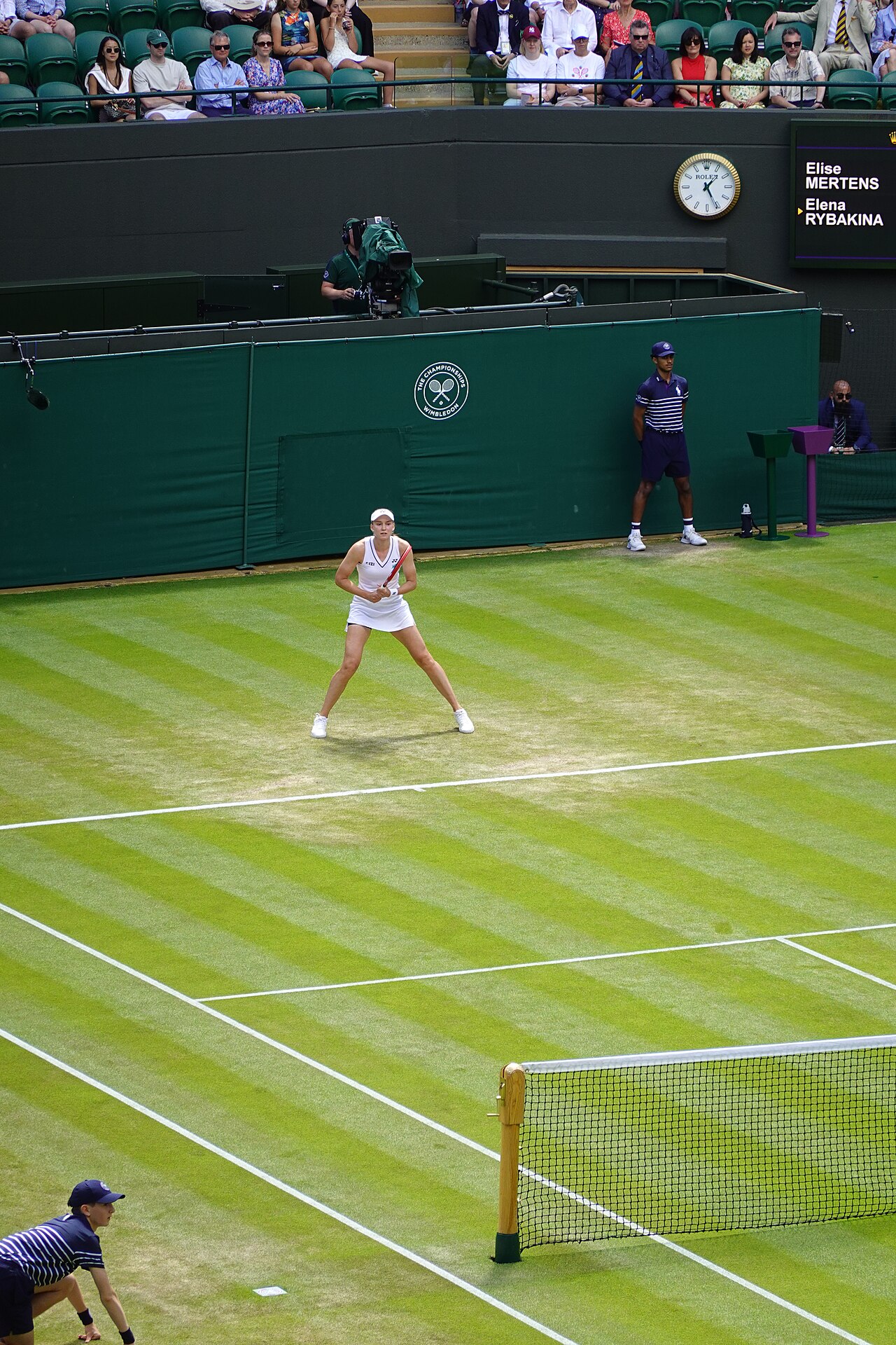 Elena Rybakina in her ready position on the grass at Wimbledon 2026, where her season of finals gathered pace