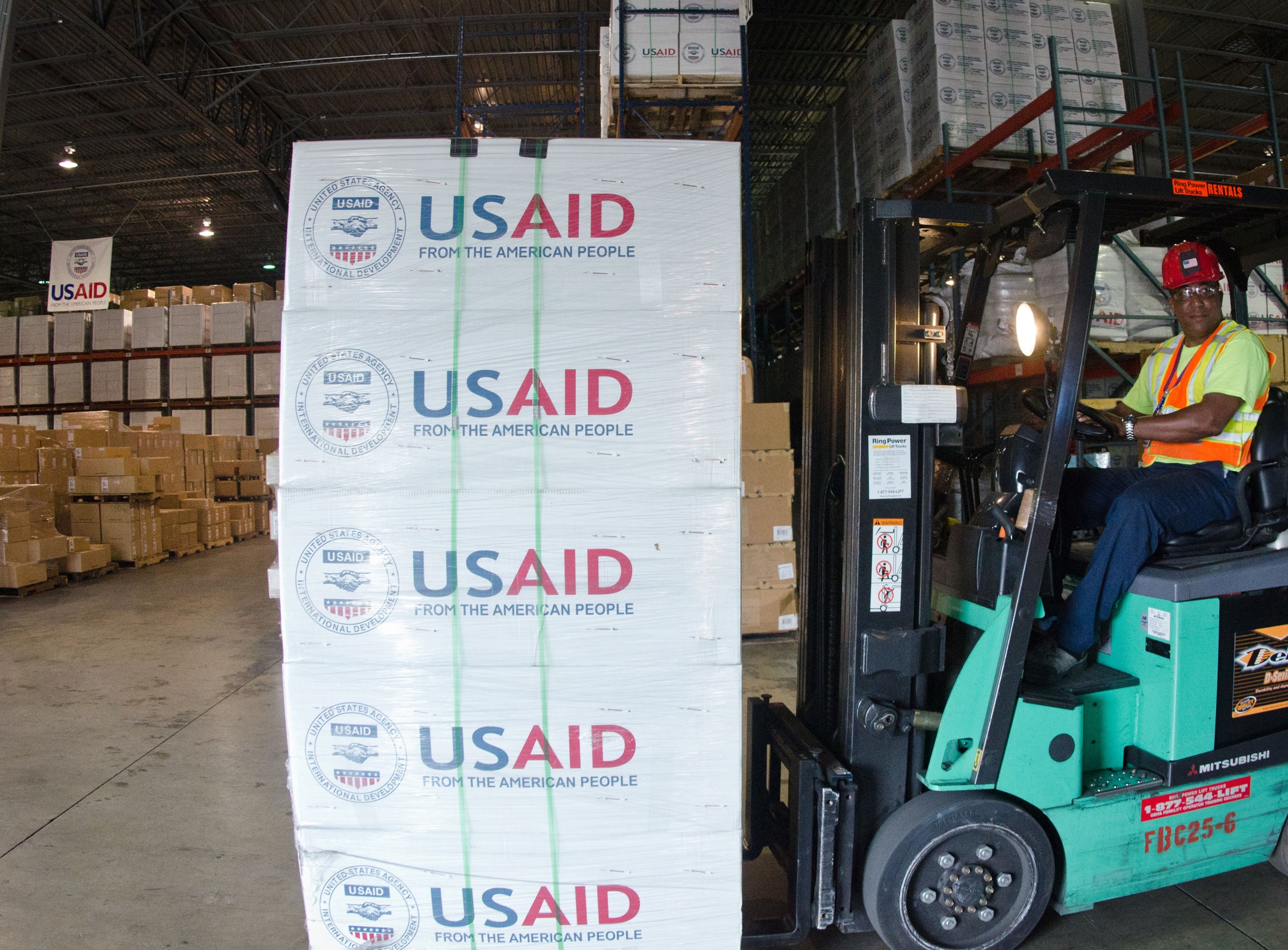 US new orders PMI October 2026 — forklifts moving goods inside a large US warehouse, as new orders hit their highest since March 2022