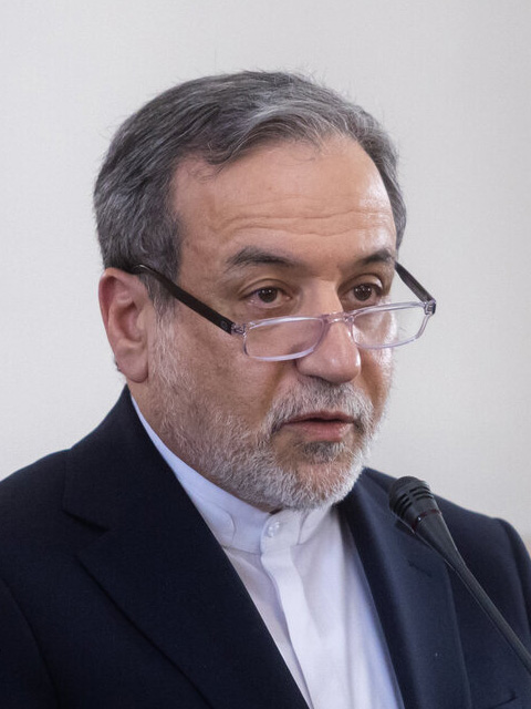 Iranian Foreign Minister Abbas Araghchi speaking at a microphone in November 2025, US Iran talks Hormuz stalemate