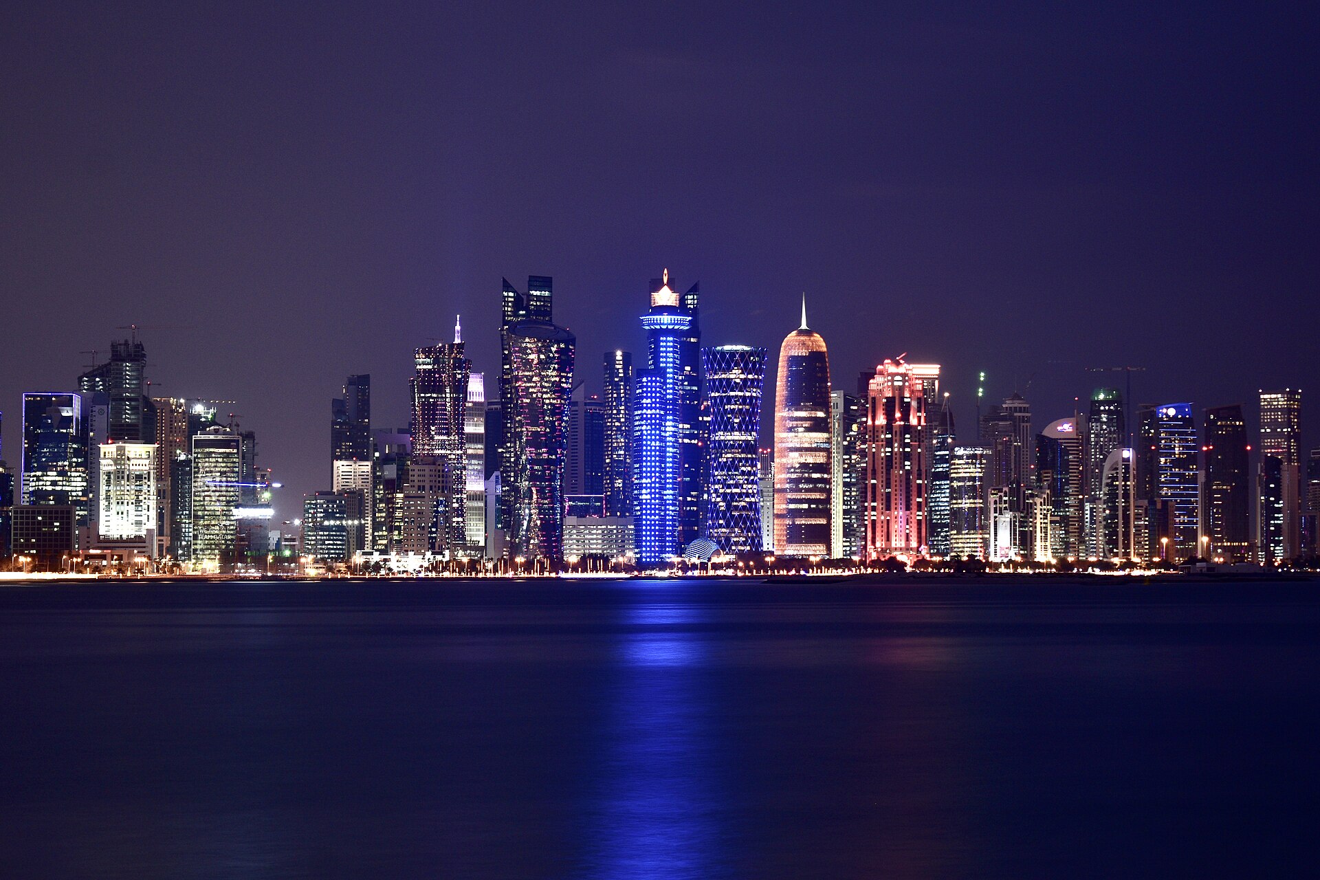 Doha West Bay skyline at night in Qatar, the intermediary capital for US Iran talks on Hormuz